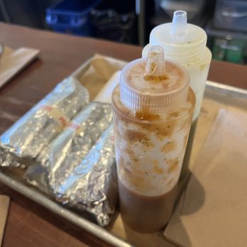 HomeState - Neatly wrapped brisket tacos with two salsas - Tex-Mex Near Me - Los Angeles, California
