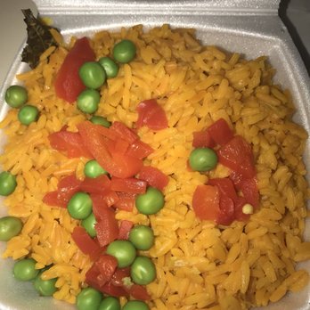 Sangria 71 - Saffron Rice with red peppers and peas on top - Spanish Near Me - Williston Park, New York Sangria 71 - Saffron Rice with red peppers and peas on top - Spanish Near Me - Williston Park, New York