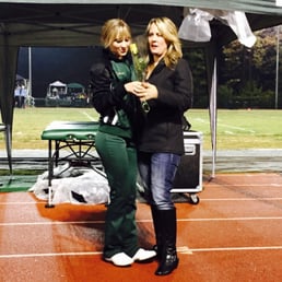Cheerleader giving fullers rose to her mom on senior night at PHS