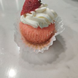  cupcake with whipped cream and a strawberry on top
