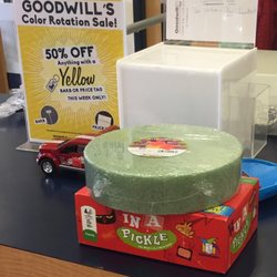 Goodwill Store & Donation Center - Yellow price tags and barbs are on sale.