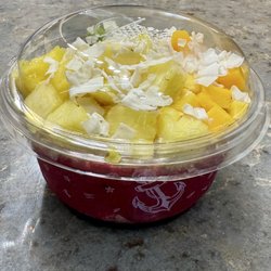 Electric Mermaid (Playa Pitaya topped with blueberry flax granola, pineapple, mango, kiwi, coconut flakes, and honey)