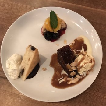 Moxies Prince George Restaurant - Tasting Trio. This included the salted caramel pecan cheesecake, sticky toffee pudding and the white chocolate brownie. So good! - Canadian (New) Near Me - Prince George, British Columbia