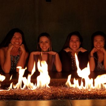 Shelter - three women sitting in front of a fire pit - Cocktail Bars Near Me - Encinitas, California Shelter - three women sitting in front of a fire pit - Cocktail Bars Near Me - Encinitas, California
