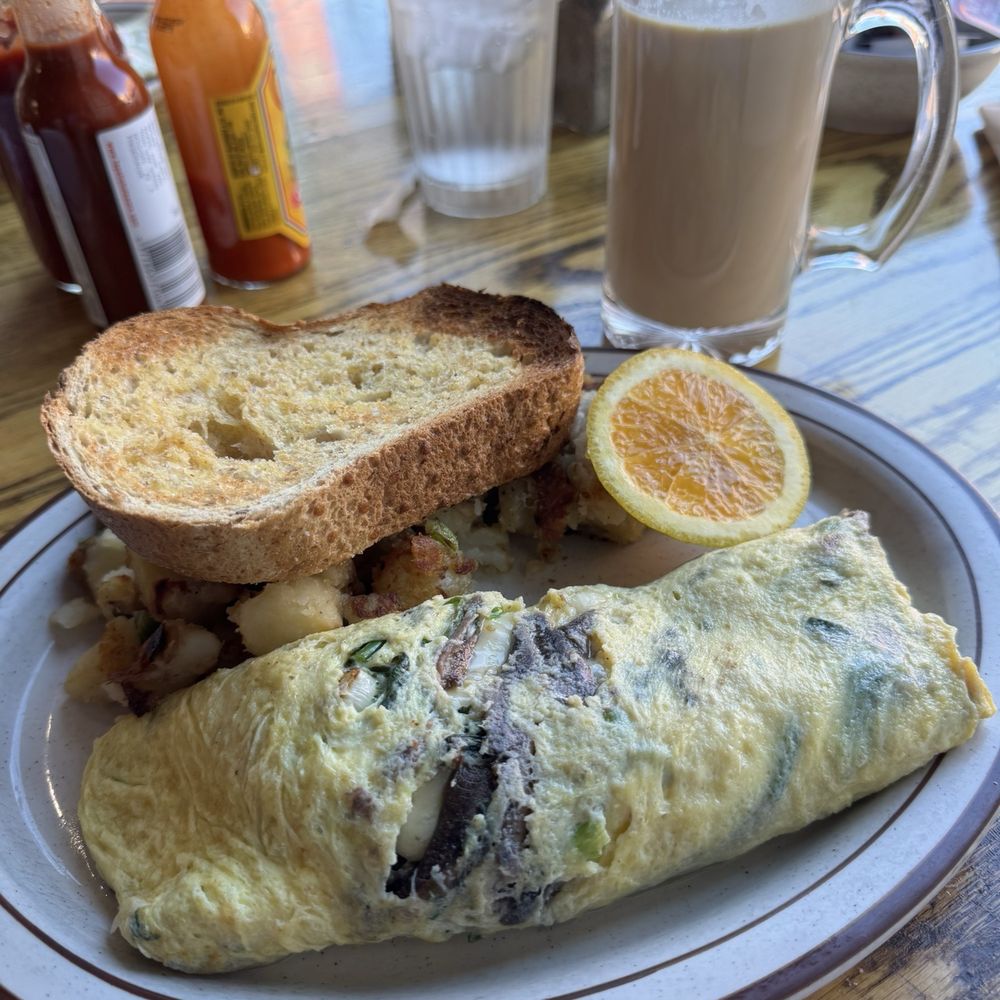 Anchovy spinach omelette with wheat sourdough and potatoes