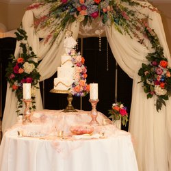 A Special Flair Party Supply and Rental - Lacy's beautiful arch draping design behind the cake table. Also, the pink lace on the cake table was from A Special Flair.