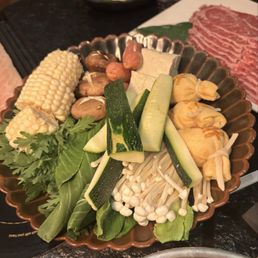 Fresh seasonal veggies and money bags