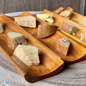 Baumkuchen Farm - a variety of breads on wooden boards - Bakeries Near Me - Papaikou, Hawaii Baumkuchen Farm - a variety of breads on wooden boards - Bakeries Near Me - Papaikou, Hawaii