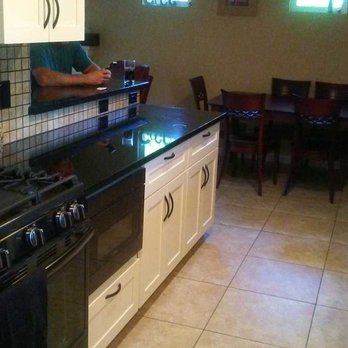BRL Builders - New raised bar after wall was removed with tile backsplash and granite countertops - General Contractors Near Me