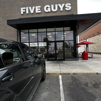 Five Guys - a car parked in front of a five guys store - Burgers Near Me - Hadley, Massachusetts Five Guys - a car parked in front of a five guys store - Burgers Near Me - Hadley, Massachusetts
