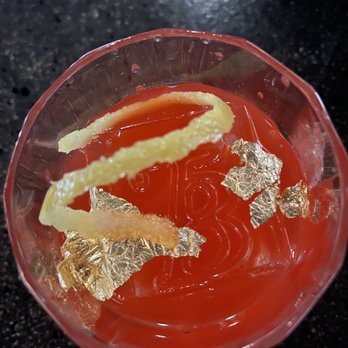 The Bunker Mixology - a glass filled with liquid and garnish - Cocktail Bars Near Me - San Antonio, Texas The Bunker Mixology - a glass filled with liquid and garnish - Cocktail Bars Near Me - San Antonio, Texas