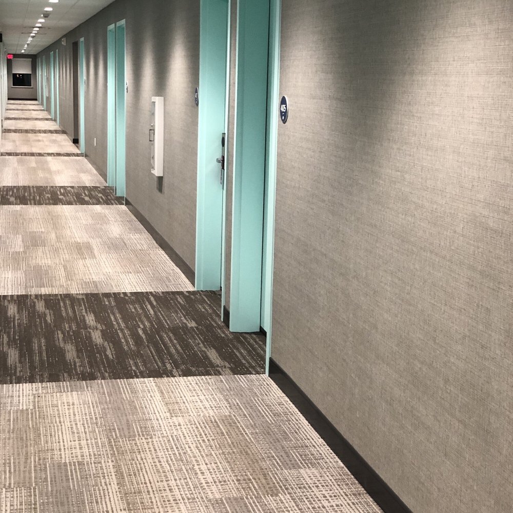 Tru by Hilton Gilbert - One side of the doors are this blue/green the other side of the hall is white. - Hotels Near Me - Gilbert, Arizona Tru by Hilton Gilbert - One side of the doors are this blue/green the other side of the hall is white. - Hotels Near Me - Gilbert, Arizona
