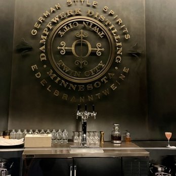 Dampfwerk Distilling - The bar area separates the customer with plexiglass from the bartender and servers. Ample spacing between you and the next customer - Distilleries Near Me - Saint Louis Park, Minnesota