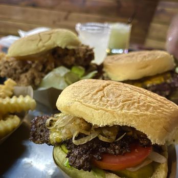 The Yard - Liberty Burger (Chicken Sando and Pineapple Pina Colada in the background - Cocktail Bars Near Me - Brentwood, California The Yard - Liberty Burger (Chicken Sando and Pineapple Pina Colada in the background - Cocktail Bars Near Me - Brentwood, California