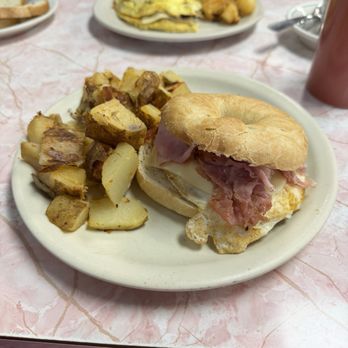 Lisciandro's Restaurant - Breakfast sandwich with ham, egg, and cheese Home fries - Italian Near Me - Jamestown, New York Lisciandro's Restaurant - Breakfast sandwich with ham, egg, and cheese Home fries - Italian Near Me - Jamestown, New York