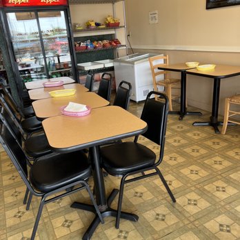 Pita Plus - a table and chairs in a restaurant - Middle Eastern Near Me - Saint Louis, Missouri