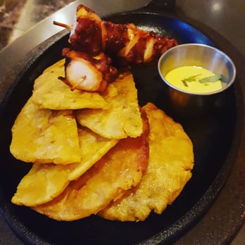 Blue Matisse - Octopus anticucho (grilled marinated octopus skewers, crispy tostones & ají huacatay sauce) - New American Near Me - Doral, Florida Blue Matisse - Octopus anticucho (grilled marinated octopus skewers, crispy tostones & ají huacatay sauce) - New American Near Me - Doral, Florida