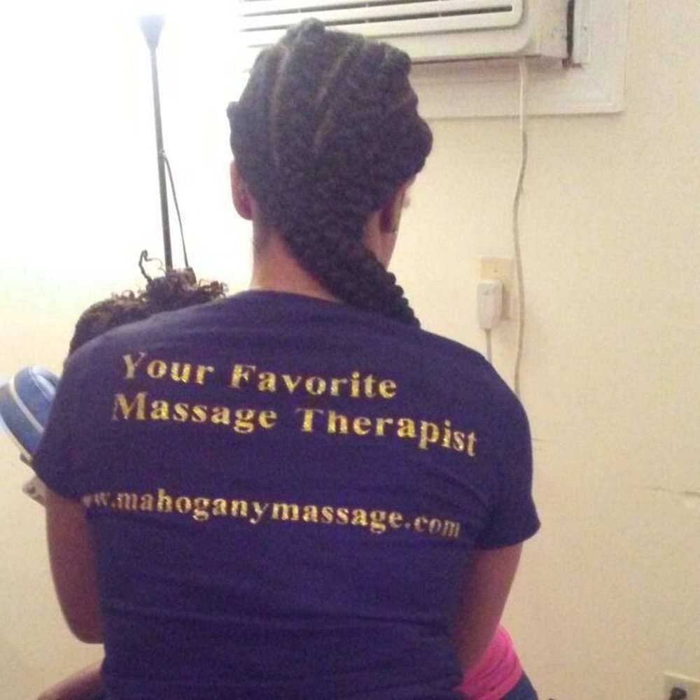 Mahogany Massage - Your Favorite Massage Therapist doing chair massage at a Breast Cancer Awareness party. - Massage Therapy Near Me - Richmond, Virginia