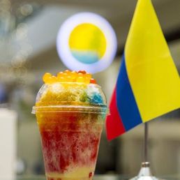 a cup of ice cream with a flag in the background a cup of ice cream with a flag in the background