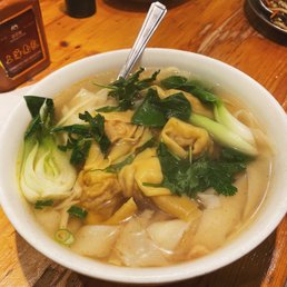 Wonton noodle soup with hand pulled wide noodles Wonton noodle soup with hand pulled wide noodles