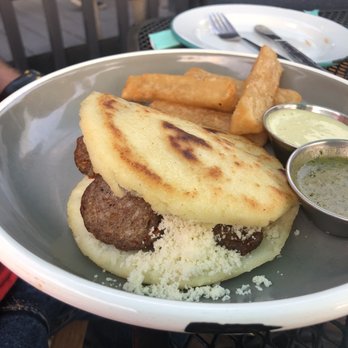 Hola Arepa - Chorizo Sausage Arepa without the cabbage because that's not Jeff's bag baby! - Latin American Near Me - Minneapolis, Minnesota Hola Arepa - Chorizo Sausage Arepa without the cabbage because that's not Jeff's bag baby! - Latin American Near Me - Minneapolis, Minnesota