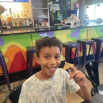 D A Taste - My son enjoying the umbrella. - Tacos Near Me - Buffalo, New York