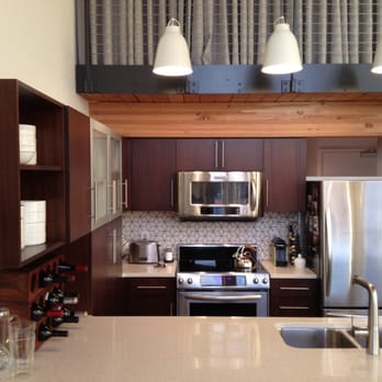 Wilson Tile and Marble - a kitchen with stainless steel appliances - General Contractors Near Me - Seattle, Washington