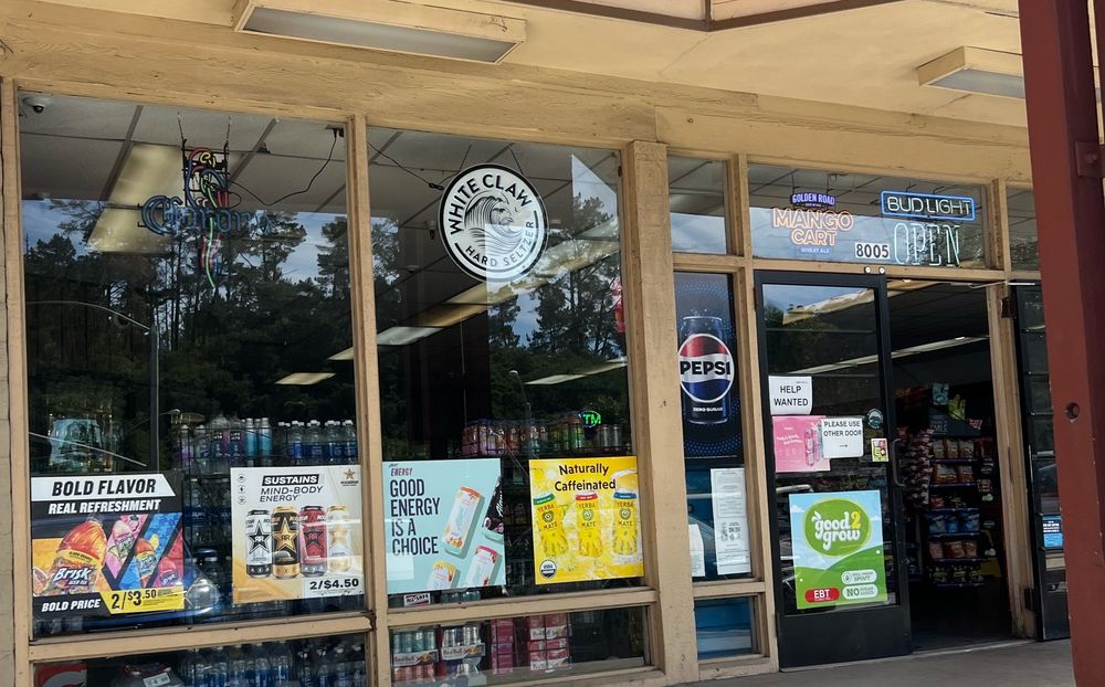 Tom's Prunedale Liquors Logo