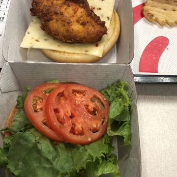 Chick-fil-A - Buyer be aware ! That's the size Chick-filA in Humble location is serving on their Spicy Dlx Chicken Sandwich. - Fast Food Near Me - Humble, Texas