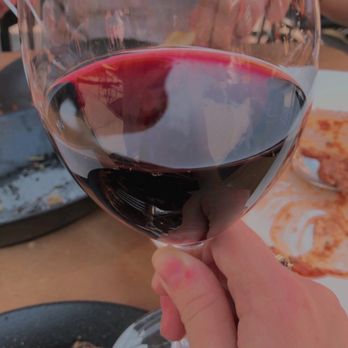 Zitto Zitto Taverna - a person holding a glass of wine - Italian Near Me - Toronto, Ontario Zitto Zitto Taverna - a person holding a glass of wine - Italian Near Me - Toronto, Ontario