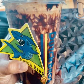 Dutch Bros Coffee - Medium Iced Mocha w/ whip cream and mocha drizzle - Juice Bars & Smoothies Near Me - Palmdale, California Dutch Bros Coffee - Medium Iced Mocha w/ whip cream and mocha drizzle - Juice Bars & Smoothies Near Me - Palmdale, California