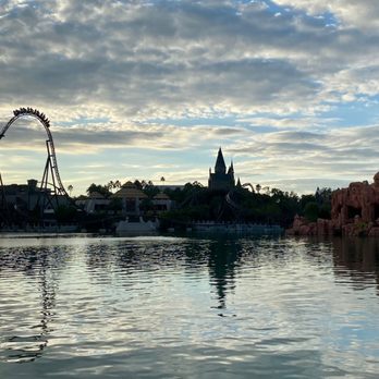 Jurassic World Velocicoaster - View of the top hat from across the water - Amusement Parks Near Me - Orlando, Florida Jurassic World Velocicoaster - View of the top hat from across the water - Amusement Parks Near Me - Orlando, Florida