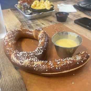 Voodoo Brewing - Virginia Beach - Half of the pretzel w beer cheese - Cocktail Bars Near Me - Virginia Beach, Virginia Voodoo Brewing - Virginia Beach - Half of the pretzel w beer cheese - Cocktail Bars Near Me - Virginia Beach, Virginia