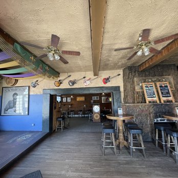 Lincoln's Roadhouse - Stage area with wall of guitars - Bars Near Me - Denver, Colorado