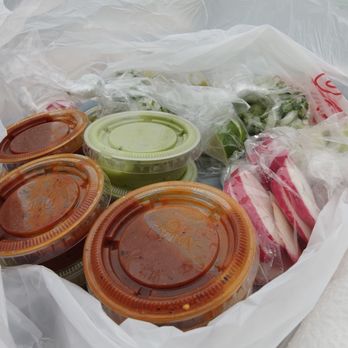 Leo's Tacos - Red and green sauces plus standard accoutrements - Tacos Near Me - San Francisco, California