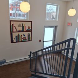 Ogdensburg Public Library - The inside of the handicap accessible enterance with the barn square that the community donated money to put their favorite books on.