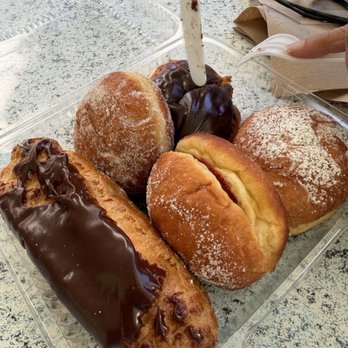 Punalu'u Bake Shop - A sampling of the malasadas and the chocolate eclair. - Bakeries Near Me - Naalehu, Hawaii Punalu'u Bake Shop - A sampling of the malasadas and the chocolate eclair. - Bakeries Near Me - Naalehu, Hawaii