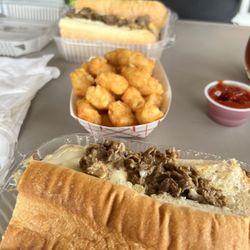 Fast Lane Philly's - Cheesesteak with peppers and mushrooms, and tots.
