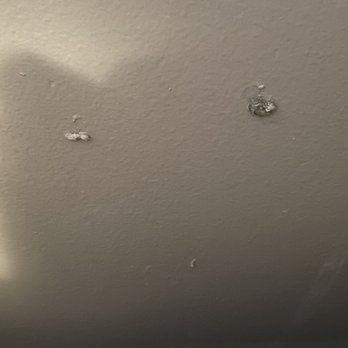 Hastings Painting & Decorating - These are moist drops of paint we found on the wall next to our bed - Painters Near Me - Evanston, Illinois