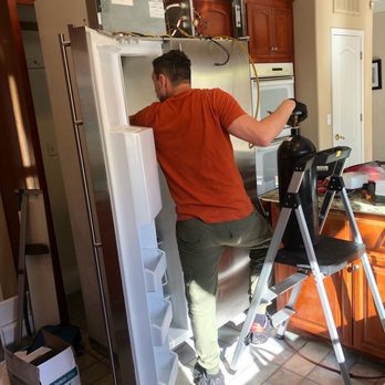 Chill Heating and Cooling - Kevin working in our GE Monogram refrigerator. - Heating & Air Conditioning/HVAC Near Me - San Ramon, California