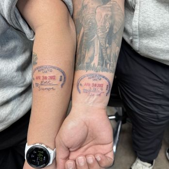 MODO Ink Tattoo - Couples matching passport stamp tattoo by Calvin - Tattoo Near Me - Orange, California