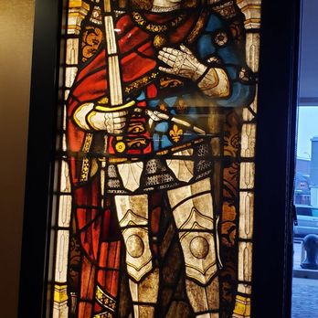 Caroline's Restaurant - a stained glass window of a knight - New American Near Me - Dubuque, Iowa