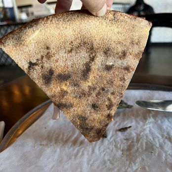 Union Pizza Company - Back of pizza dough. Over cooked crunchy and tough instead of crispy - Pizza Near Me - Manhattan Beach, California