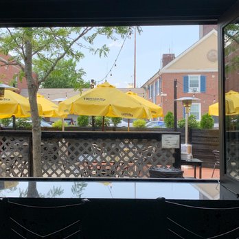 Oscar's - Bar side window overlooking the outdoor patio. - Bars Near Me - Dedham, Massachusetts