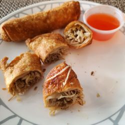 New Moon Restaurant - Chicken Egg Rolls from New Moon $1.65 each cut for dipping.  Sauce too watery. Thursday 8/24/2023
