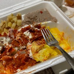 Taco's To Go - Red Chilaquiles with sunny side up egg.