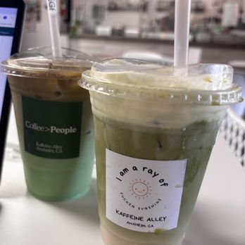 Kaffeine Alley - Pandan Latte (L) Matcha Latte with Vanilla Foam (R) - Coffee & Tea Near Me - Anaheim, California Kaffeine Alley - Pandan Latte (L) Matcha Latte with Vanilla Foam (R) - Coffee & Tea Near Me - Anaheim, California