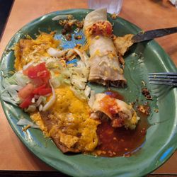 The burrito and enchilada. Some of the lettuce on the enchilada and the cheese/tomato on the burrito is from the taco that I had eaten.