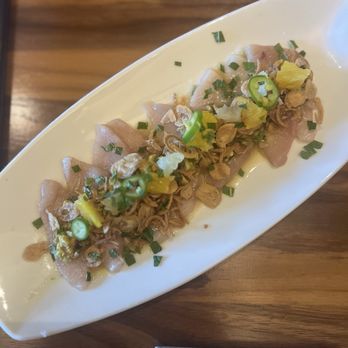 Zasu - Hamachi Crudo | pistachio, citrus, Serrano chiles, mint, crispy shallots - New American Near Me - New Orleans, Louisiana Zasu - Hamachi Crudo | pistachio, citrus, Serrano chiles, mint, crispy shallots - New American Near Me - New Orleans, Louisiana