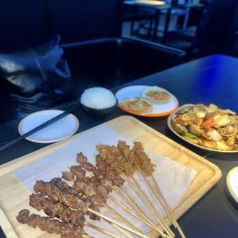 Xinjiang BBQ - Beef Skewers (left), Chicken Gizzard, Chicken Skin (right) - Asian Fusion Near Me - San Diego, California Xinjiang BBQ - Beef Skewers (left), Chicken Gizzard, Chicken Skin (right) - Asian Fusion Near Me - San Diego, California